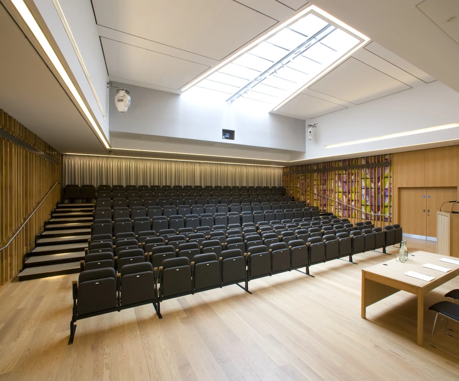Shows an empty auditorium under a skylight