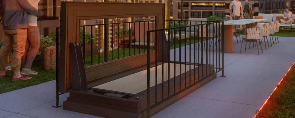 picture on a rooftop with people around highlights the access skylight in the middle which led to the roof top